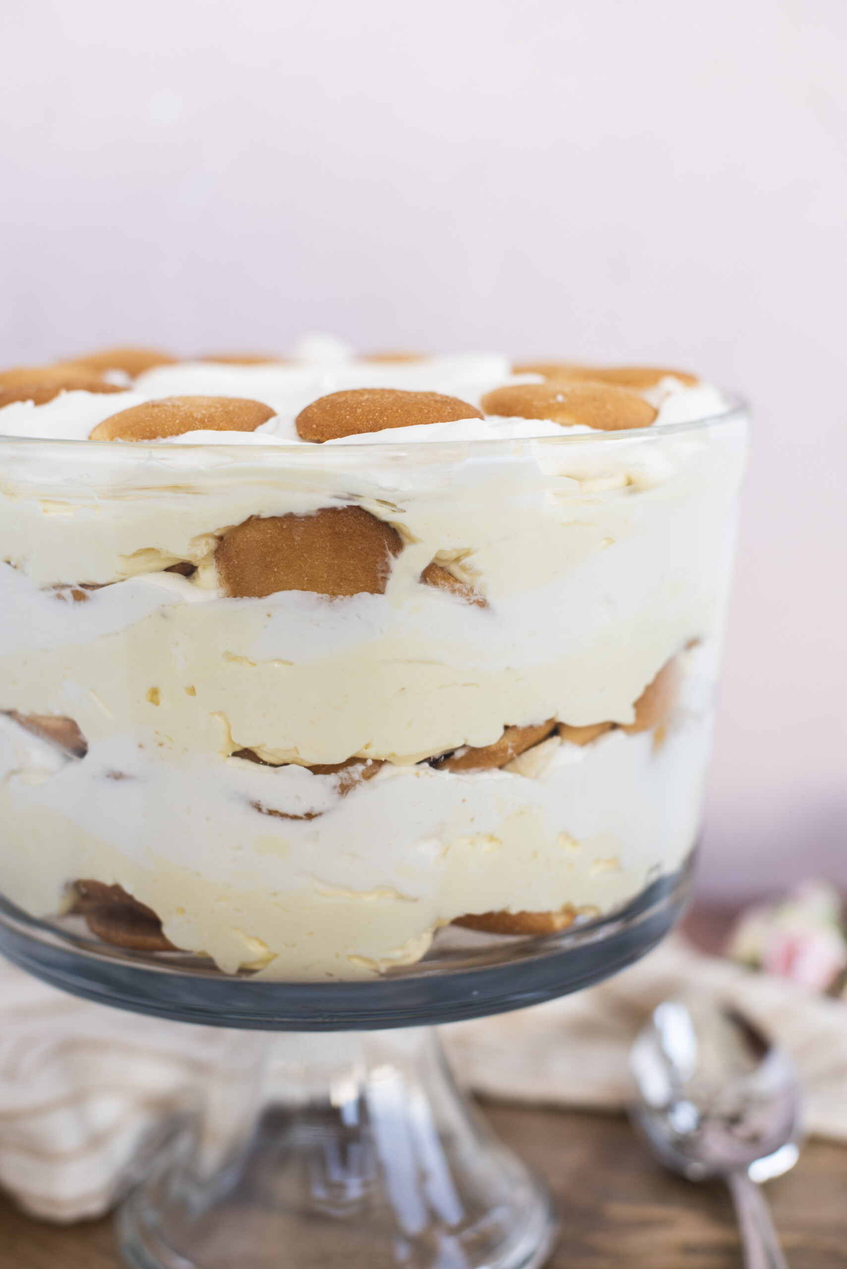 Layered banana cream pudding in a trifle dish.