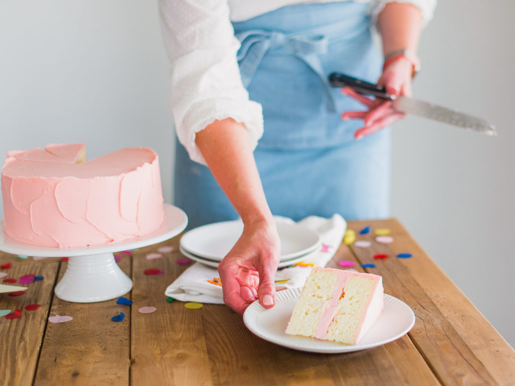 A slice of cake being served on a plate.