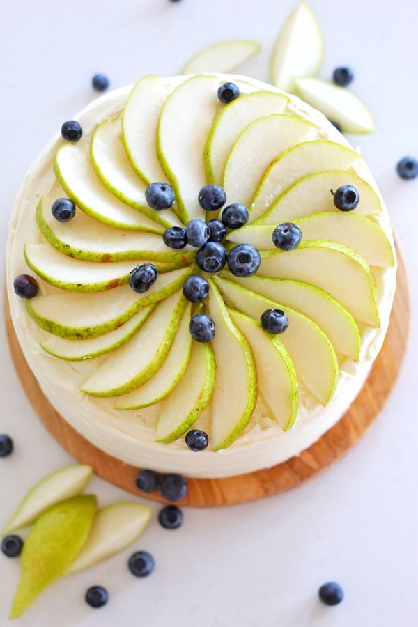 Honey Pear Upside Down Cake - layers of honey butter cake baked with caramelized pears and smothered in a honey cream cheese frosting #cakebycourtney #honeycake #buttercake #pearcake #pears #cake #easycakerecipe #upsidedowncake #cakebycourtney #honeypearupsidedowncake