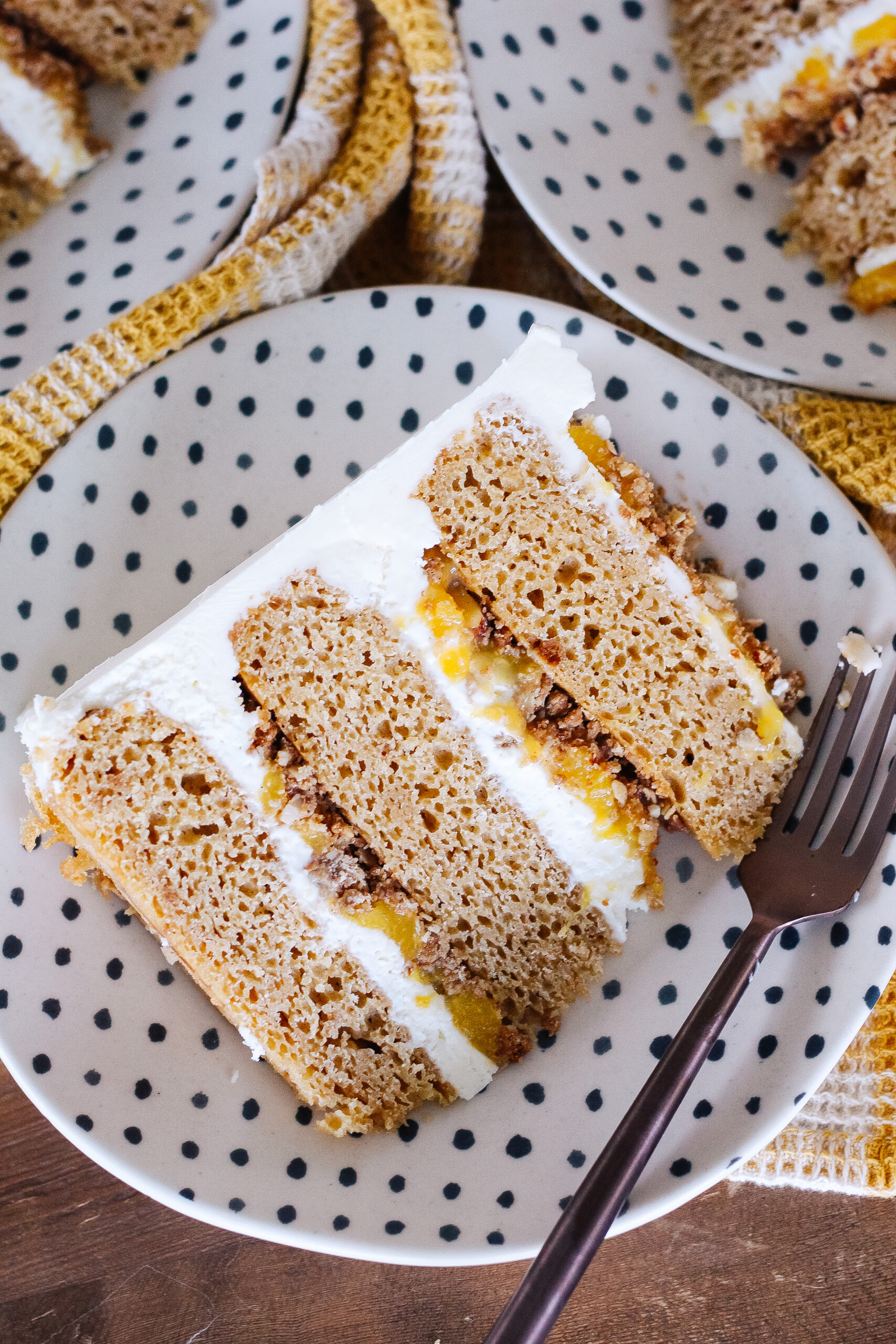 Biscoff cake on a polka dot plate with a fork.