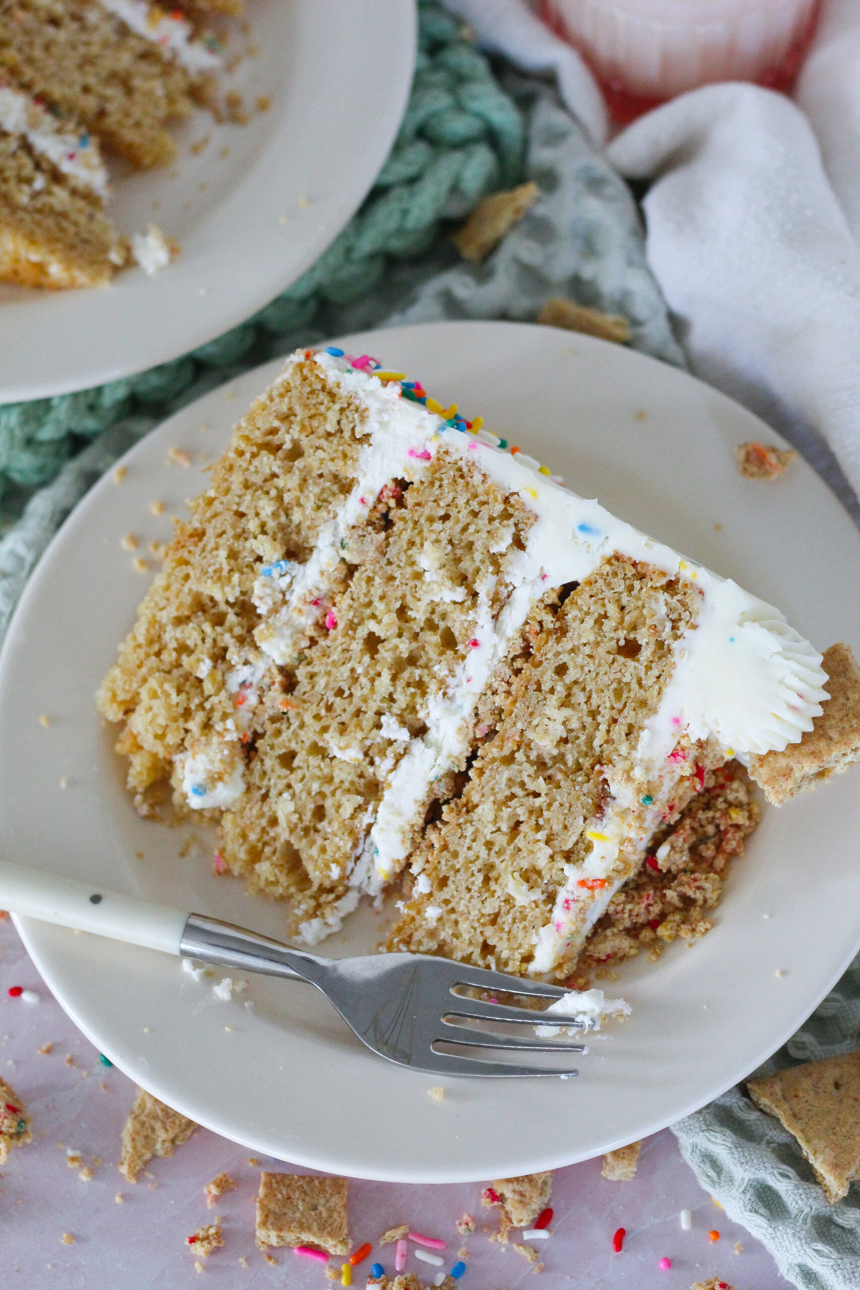 Slice of cake on a plate with a fork.