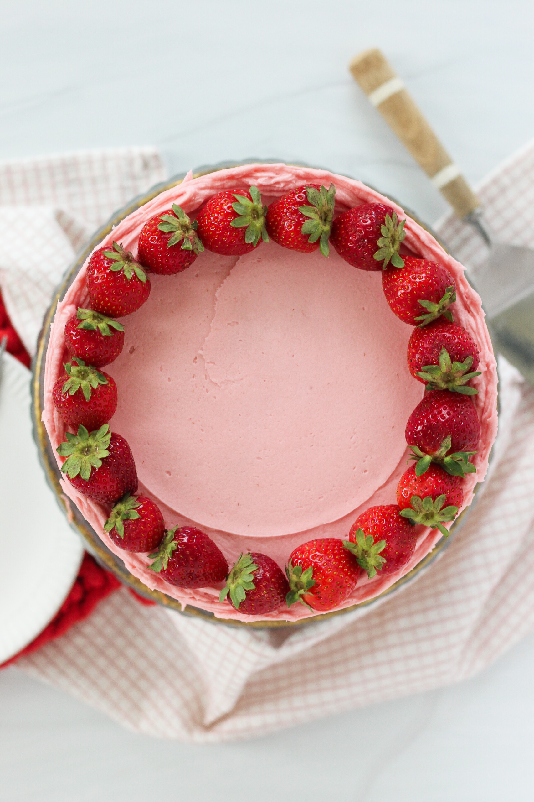 Strawberries on top of a cake.