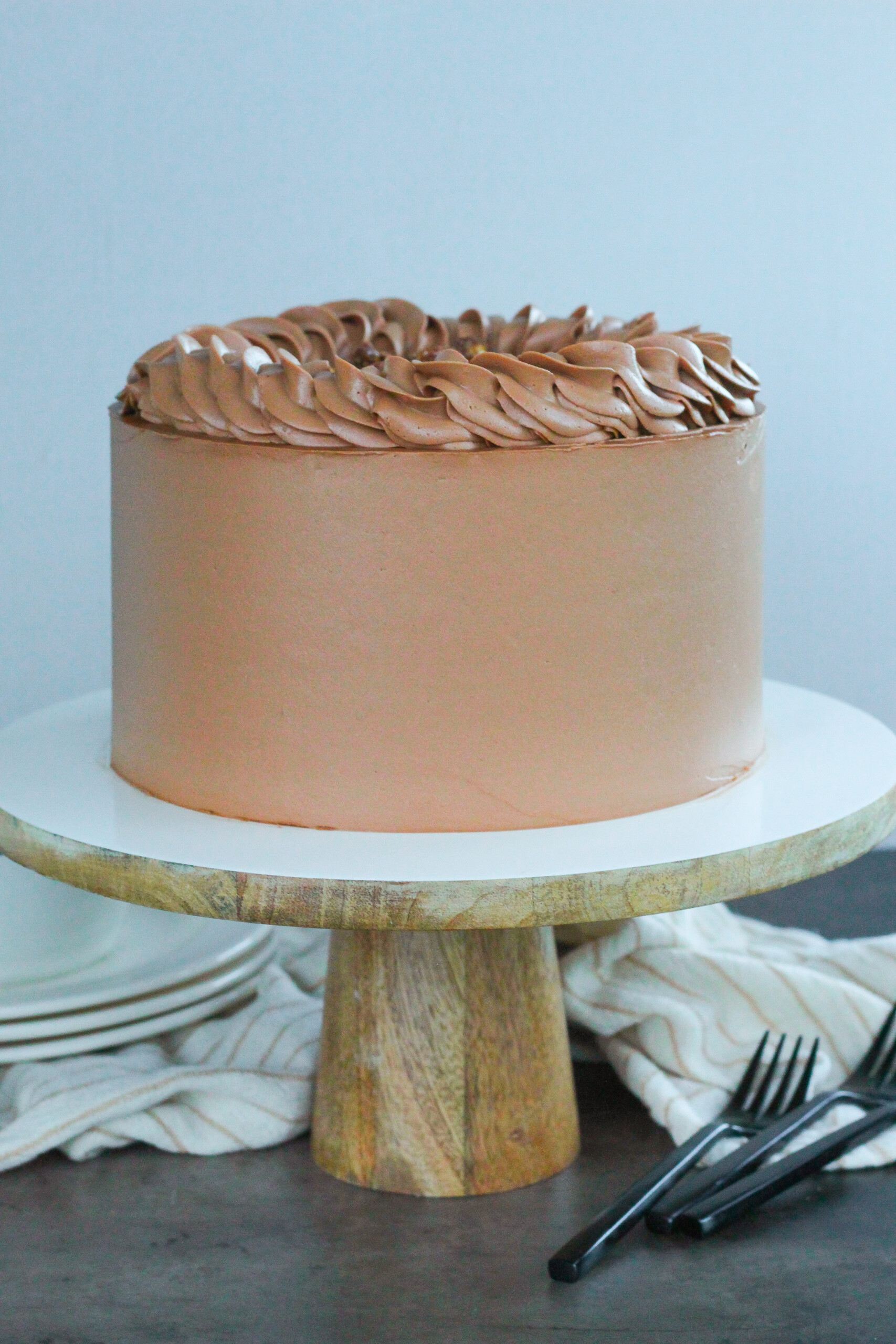 Chocolate cake on a cake stand.