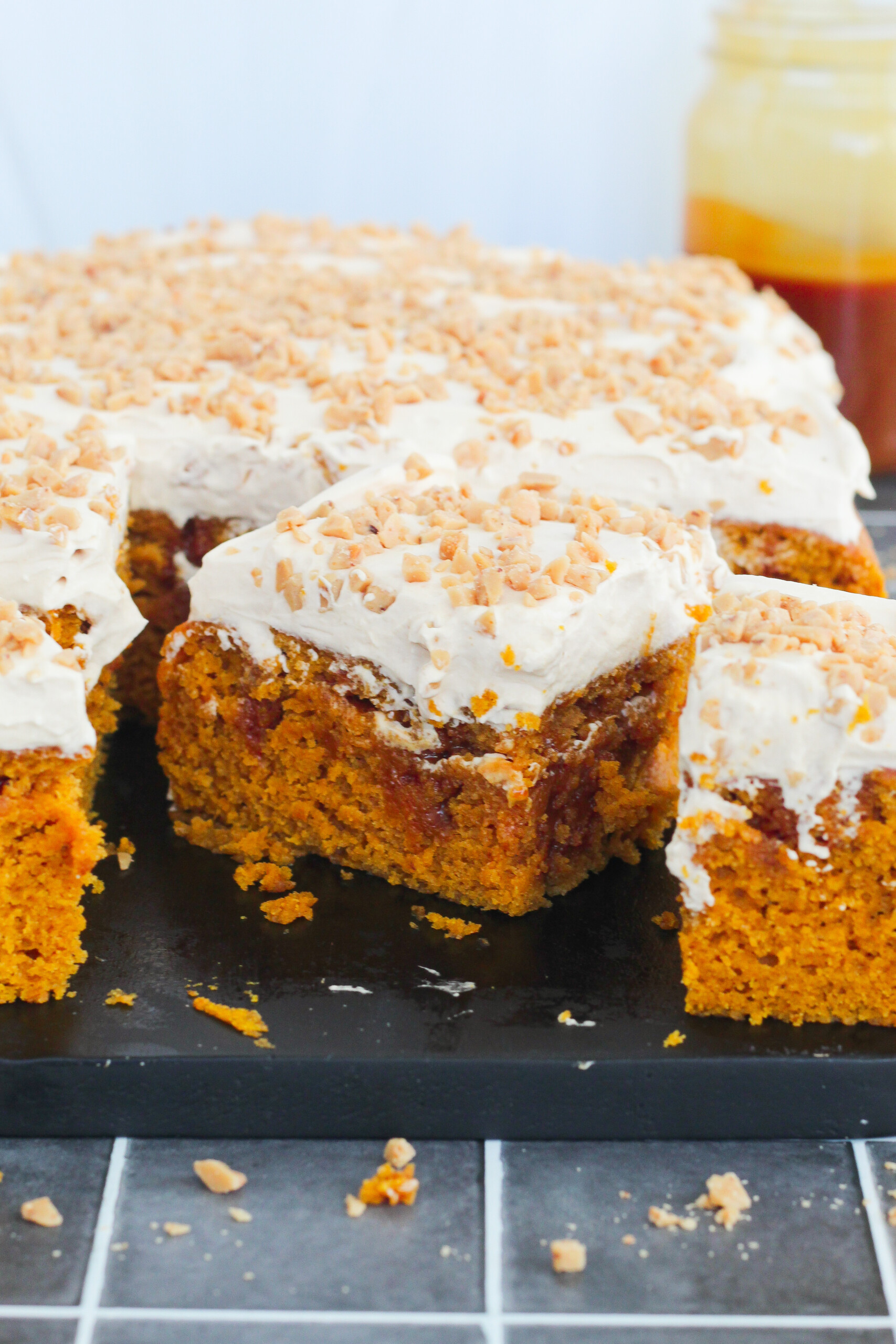 Slices of pumpkin cake on a cutting board.