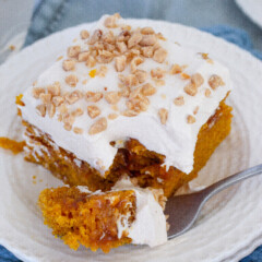 Slice of cake on a plate with a fork.