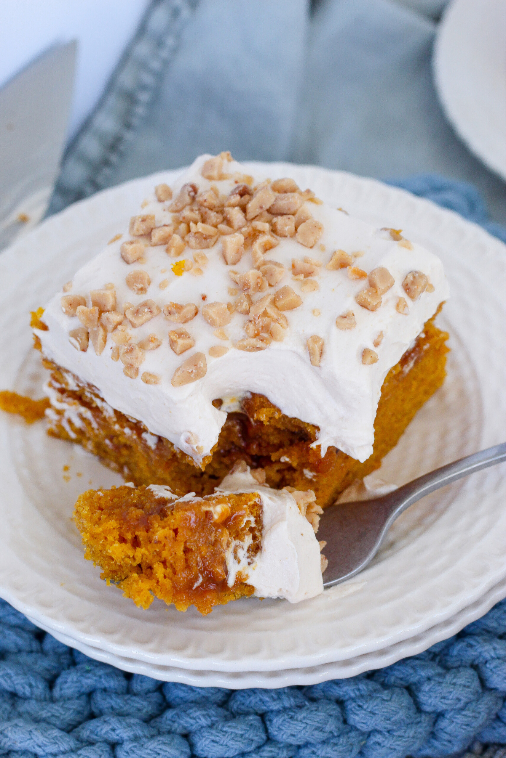 Slice of cake on a plate with a fork.