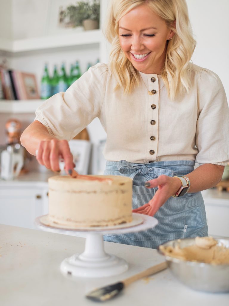 Oatmeal Biscoff Cake: oatmeal chocolate chip cake layers baked on a Biscoff crust, topped with Biscoff spread and Biscoff buttercream. #cakebycourtney #cakerecipe #oatmealcakerecipe #biscoff #cookiebutter #cookiebuttercakerecipe #biscoffbuttercream #cookiebutterbuttercream