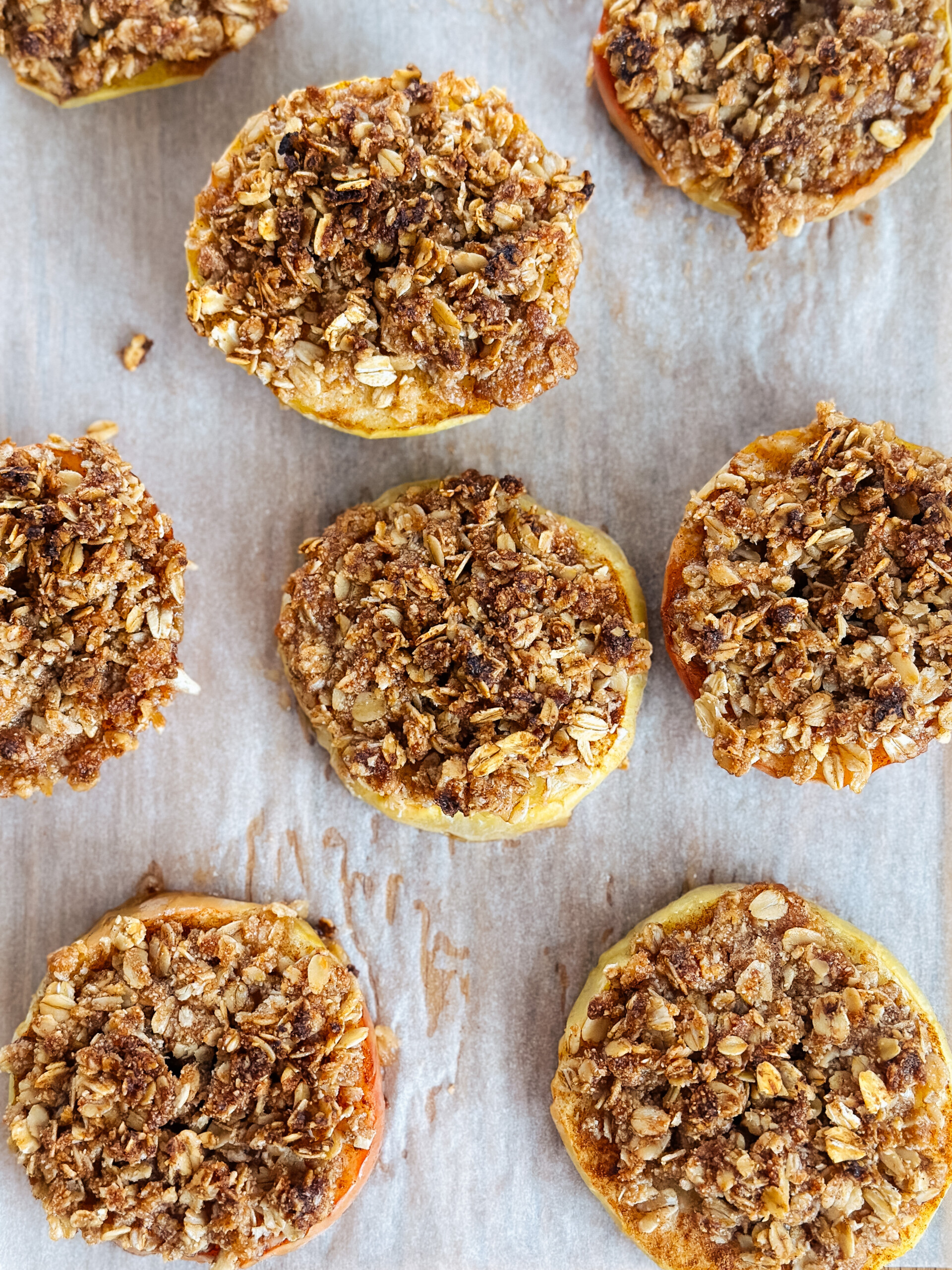 Baked apple bites on a cutting board.