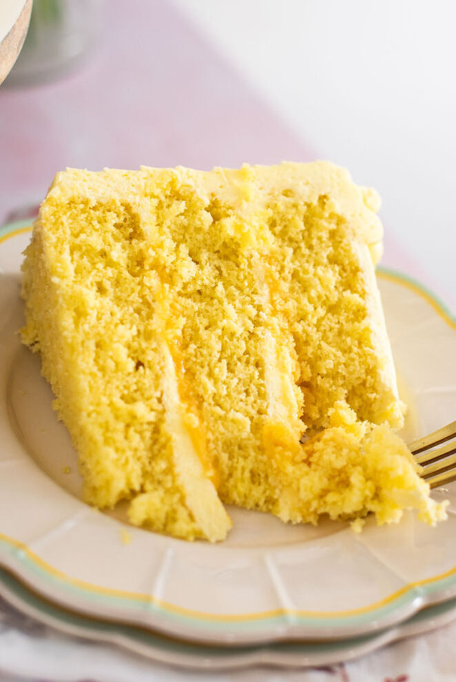 Slice of lemon cake on a plate.
