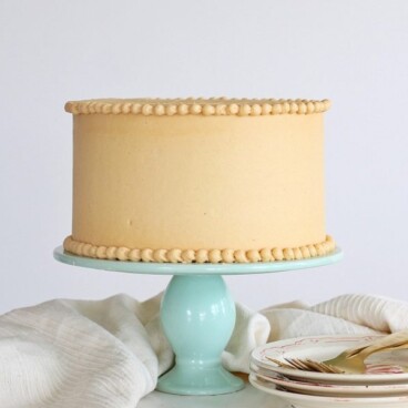 peanut butter cake covered in the creamiest peanut butter buttercream. www.cakebycourtney.com